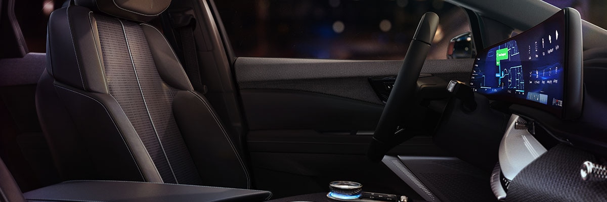 Cadillac OPTIQ 2027 con asientos delanteros, consola y pantalla central